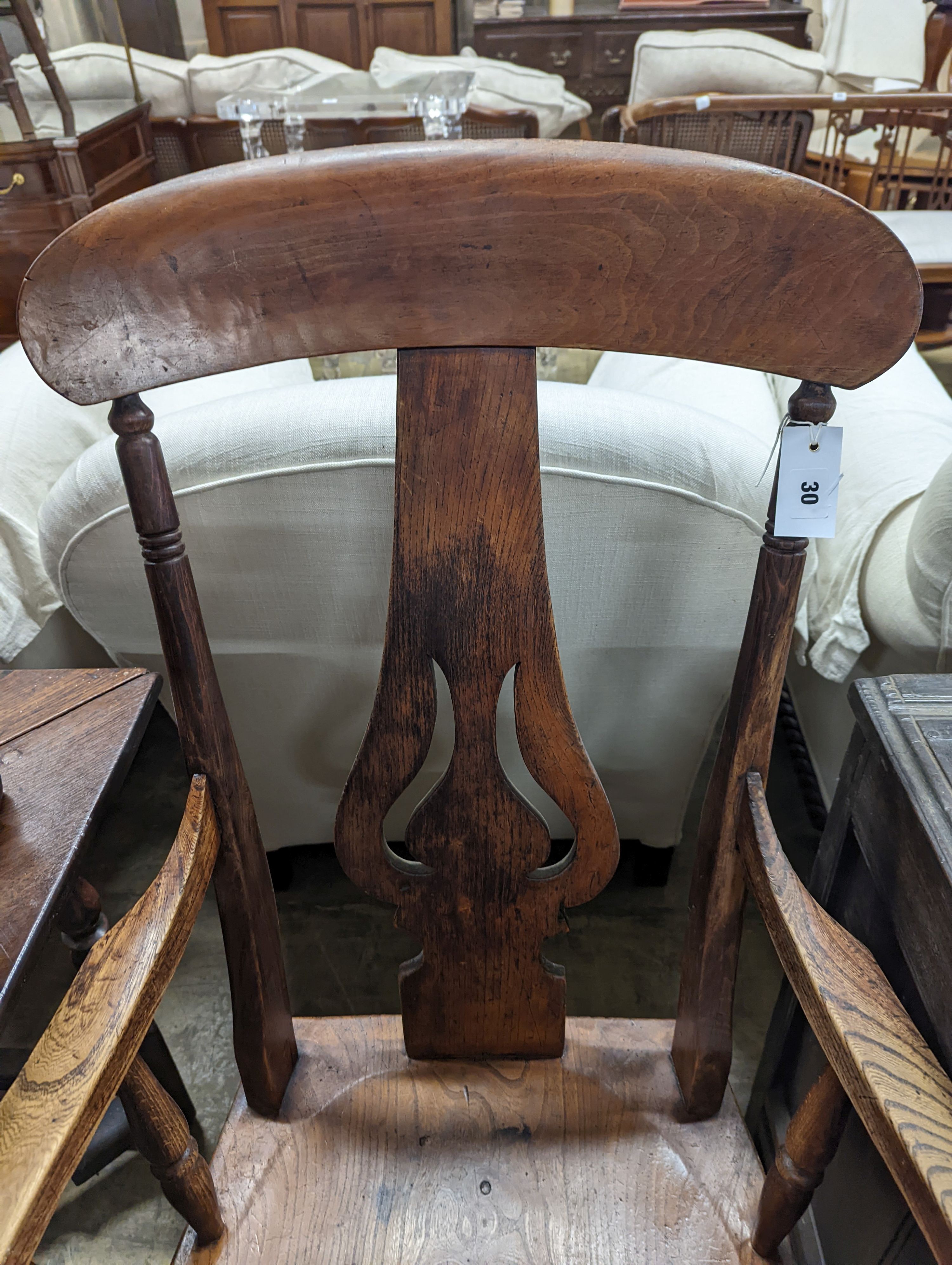 A Victorian elm and beech Windsor armchair with pierced splat stamped J D 33, width 56cm, depth 43cm, height 112cm